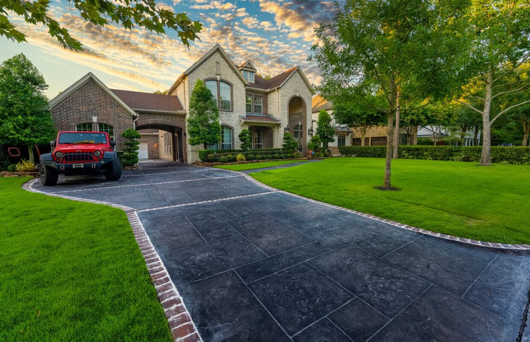 Professional driveway pressure washing service showing before and after results